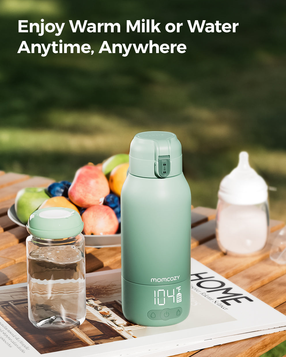 Momcozy portable breast milk and water warmer in mint green, LCD display, ideal for travel and quick warming of milk.