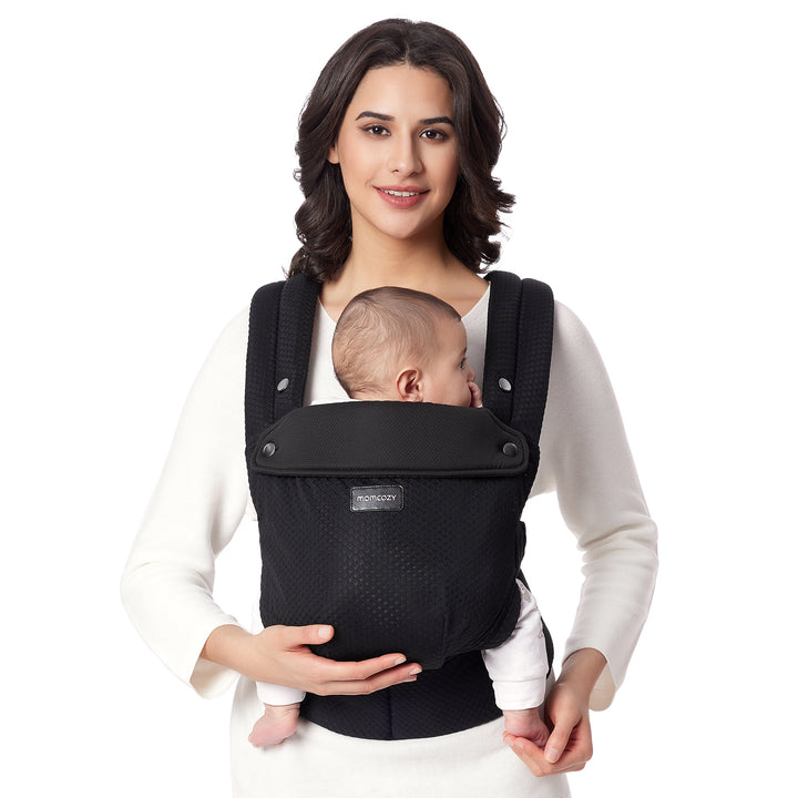 Momcozy black ergonomic baby carrier designed for infants and optimal comfort.