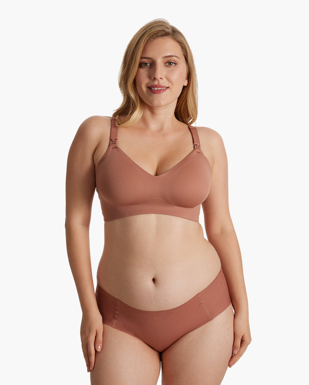 Smiling model in warm cinnamon Ultra Soft Seamless Nursing Bra YN21. Highlights V-neck, adjustable fit for M5 pump.
