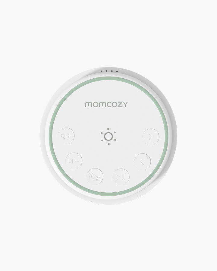 Momcozy Portable Baby Sound Machine top view showing buttons and brand logo.