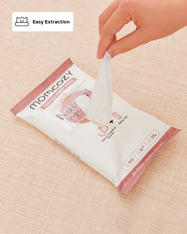 Momcozy Natural Breast Pump Wipes being pulled from an easy-extraction pack for quick access.