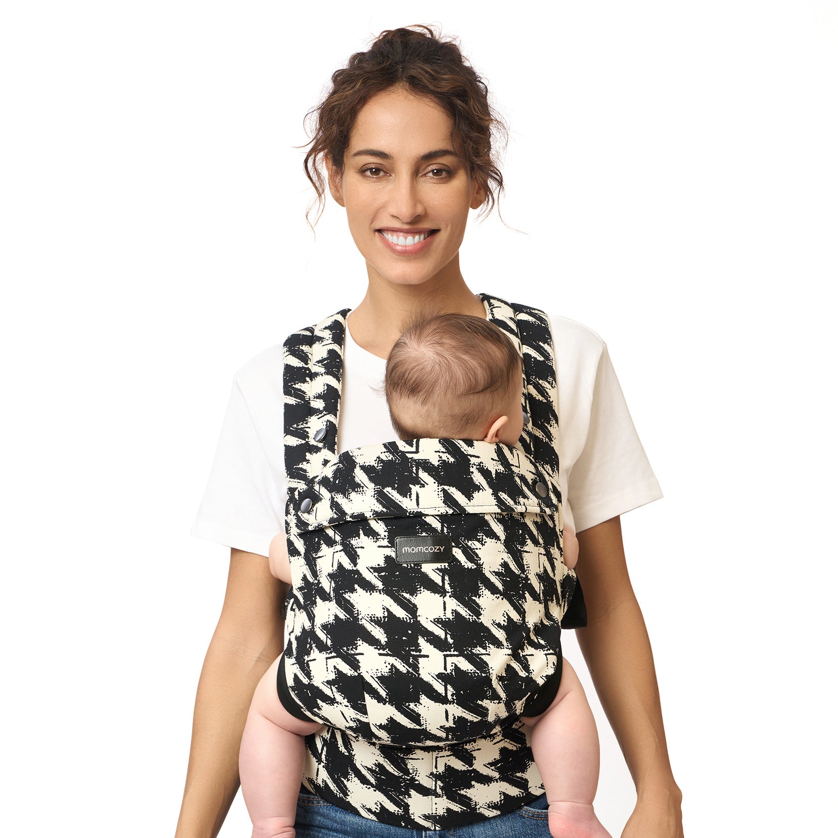 Momcozy PureHug baby carrier, houndstooth design. Mother babywearing a newborn, comfortable and supportive.