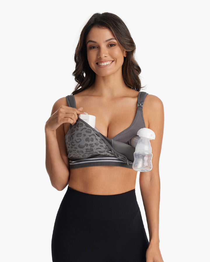 Model in grey leopard print HF022 4-in-1 hands-free seamless pumping bra, demonstrating convenient nursing access.