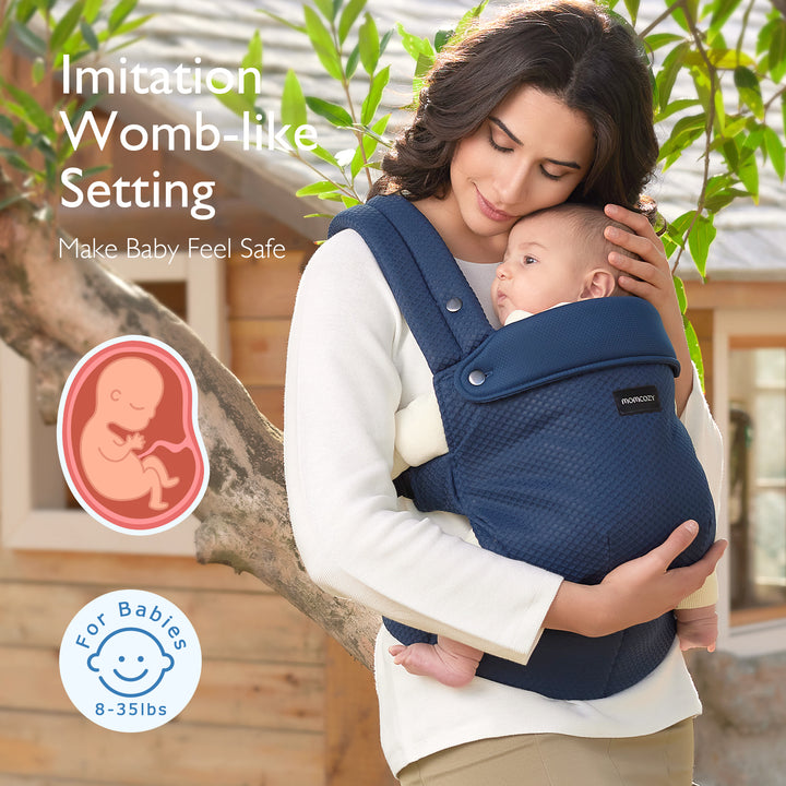 Momcozy navy baby carrier showcasing womb-like setting for infants 8-35 lbs.