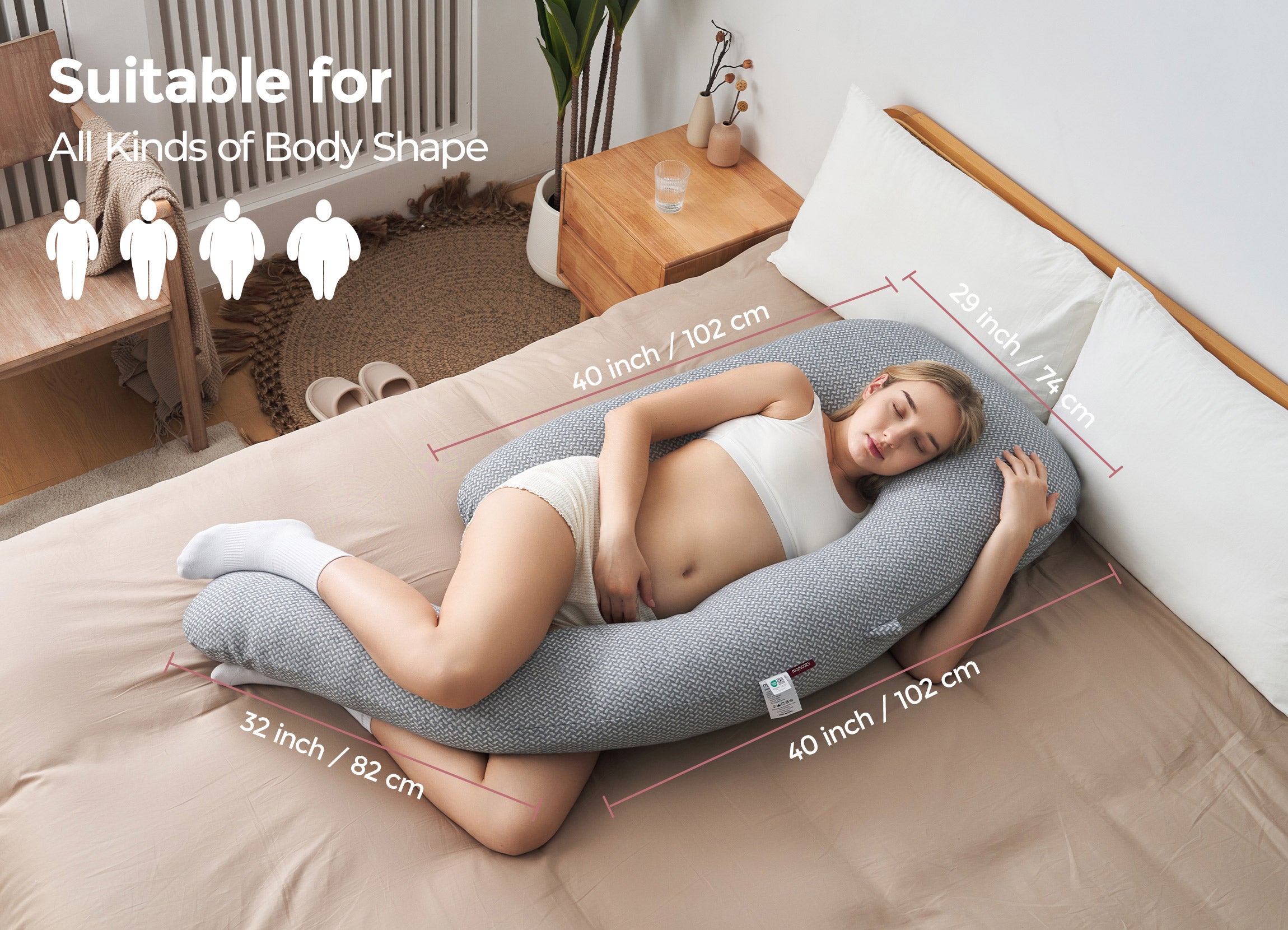 Momcozy Dreamlign pregnancy pillow for pregnant women, gray color, supporting all body shapes for comfortable sleep.