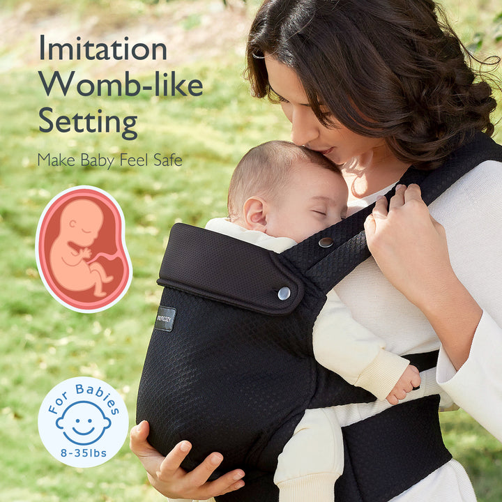 Momcozy black baby carrier providing womb-like comfort for infants 8-35 lbs.