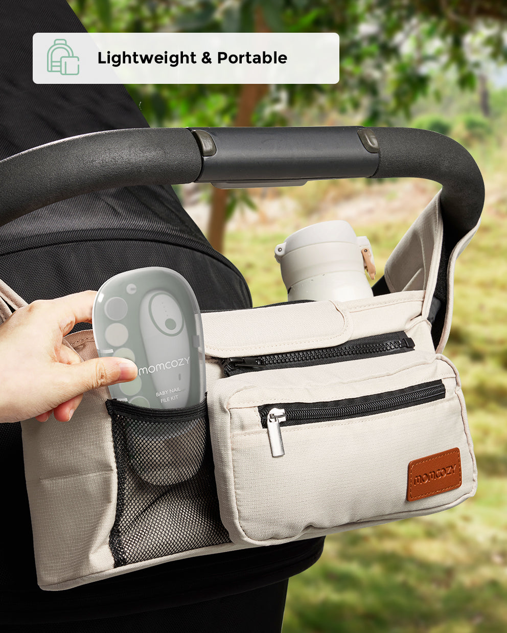 Momcozy nail file placed in a stroller organizer, showcasing portability and convenience.