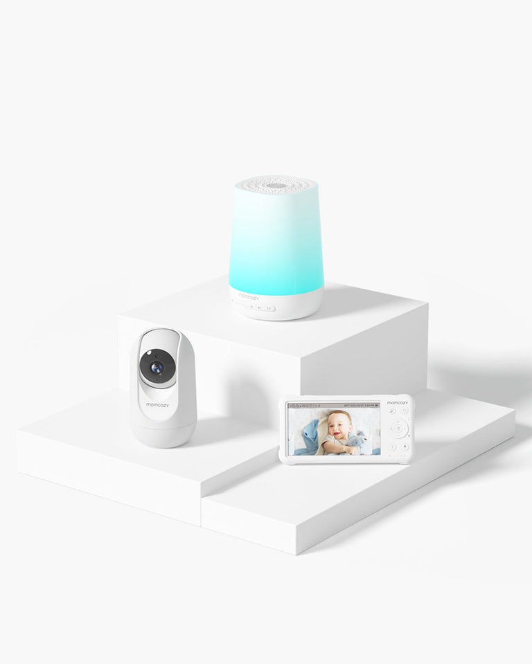 Translation missing: en.Momcozy Baby Care Bundle with smart baby sound machine, baby monitor camera, and baby monitor screen displaying a baby. Essential products for baby care