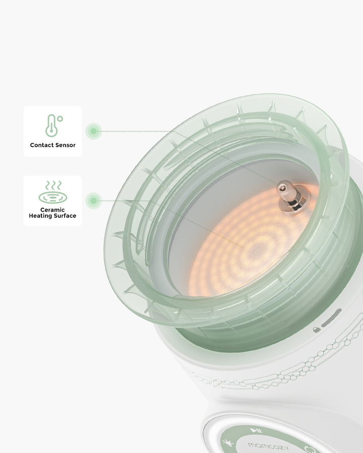 Top view of portable baby bottle warmer showing ceramic heating surface and contact sensor.