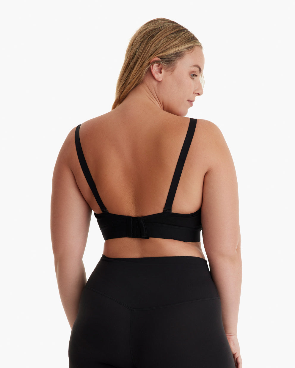 Blonde model rear view in black YN08 pumping bra with adjustable straps, wide underband, hook closure.