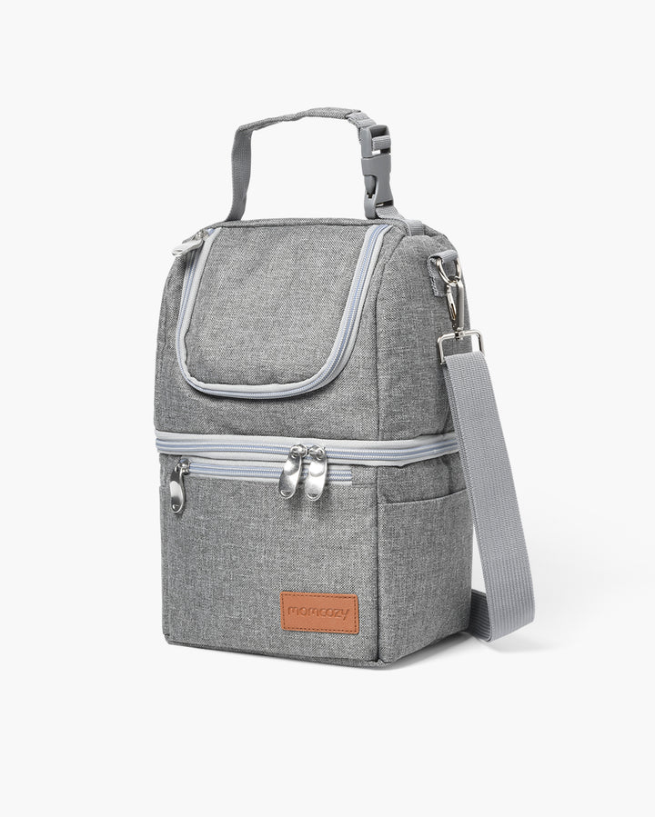 Compact gray cooler bag for breastmilk with a detachable shoulder strap and zip closure.