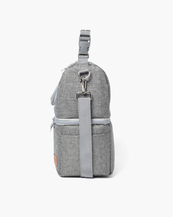 Gray breastmilk cooler bag with detachable shoulder strap and zip closure for easy transport.