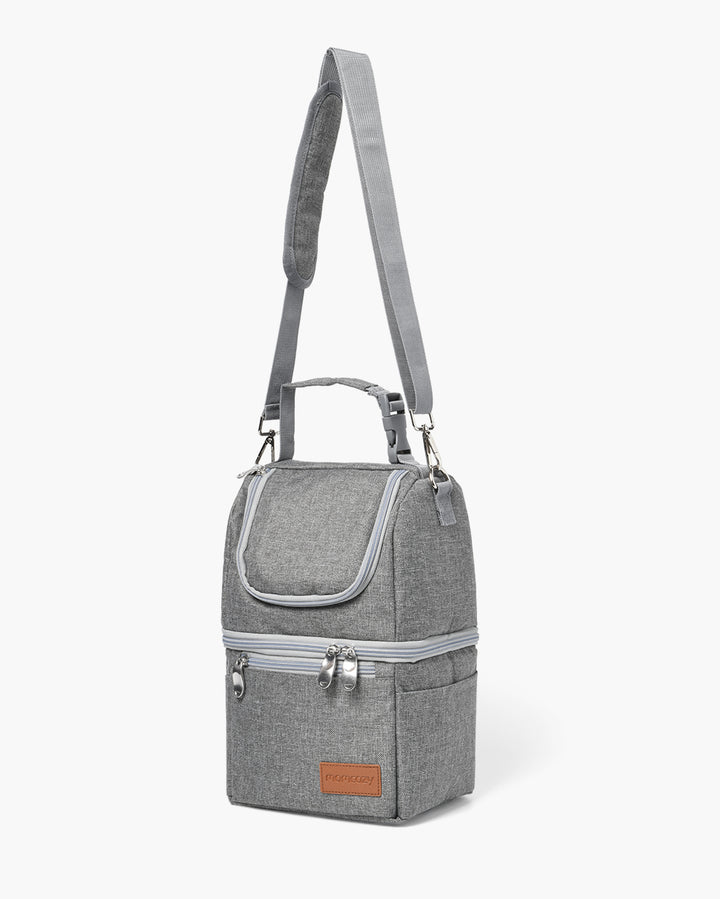 Gray breastmilk cooler bag with adjustable strap for moms on the go.